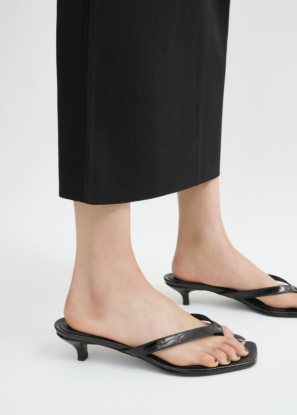 Croco-embossed heeled flip flops black