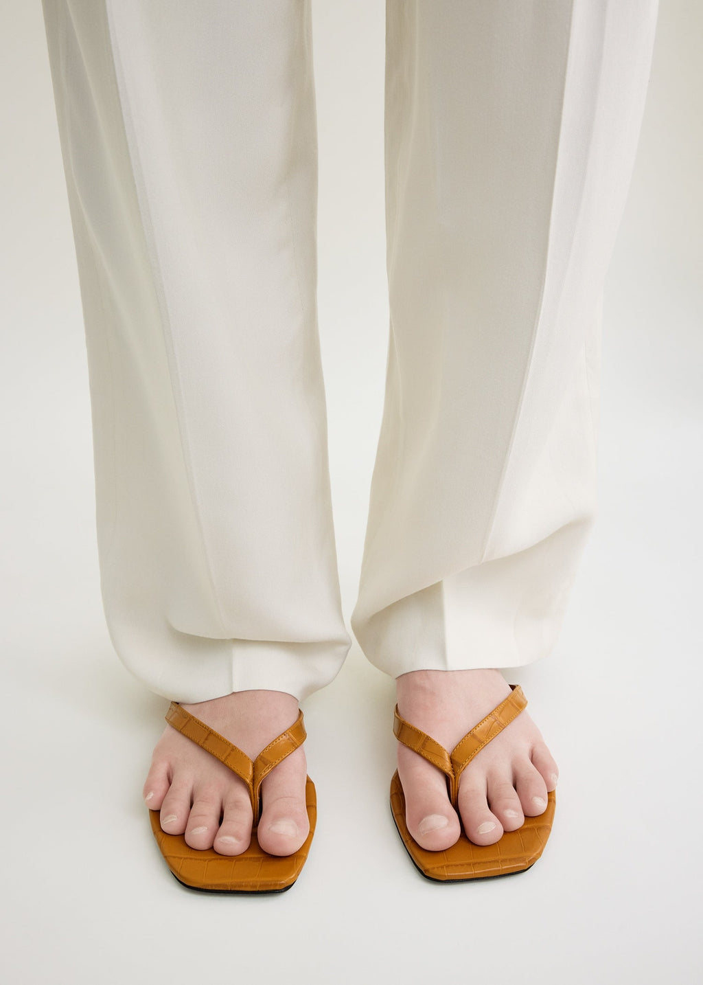 Croco-embossed flip flops tangerine