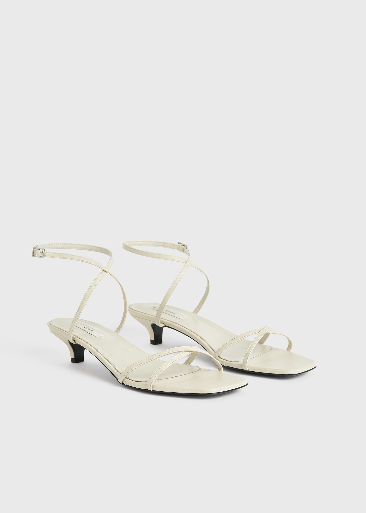 Leather crossover sandals off-white