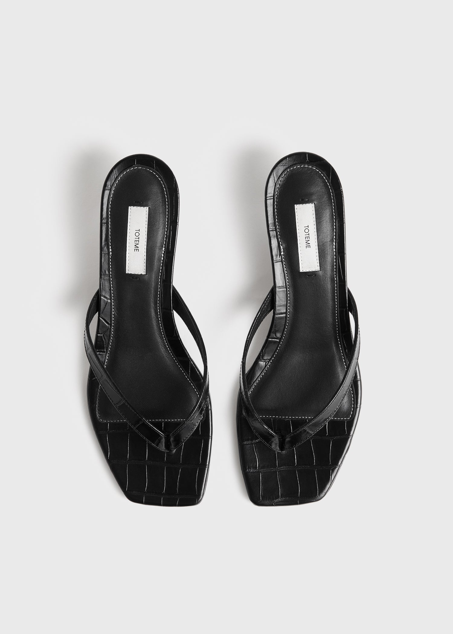 Croco-embossed heeled flip flops black