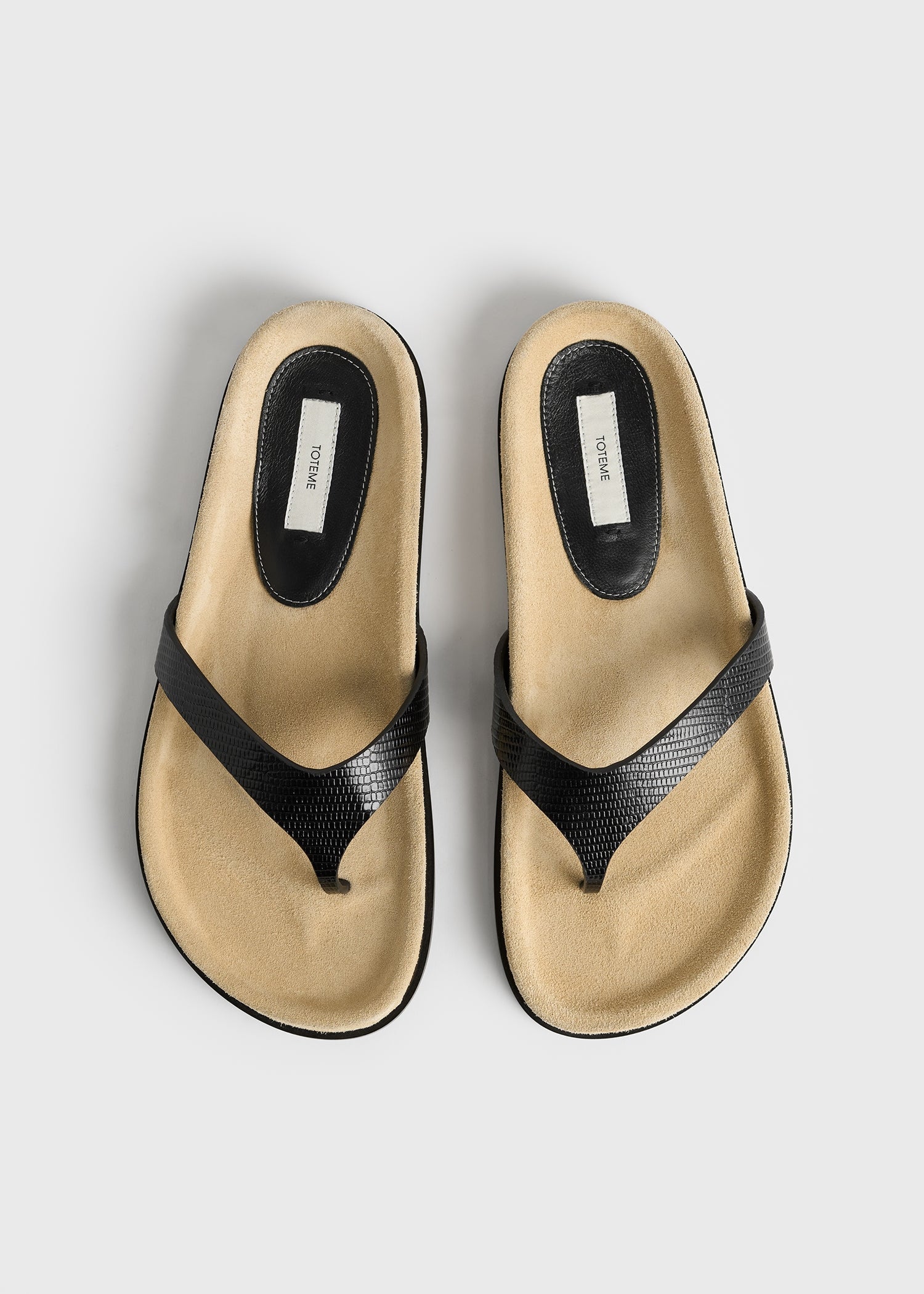 Contoured lizard-embossed flip flops beige/black
