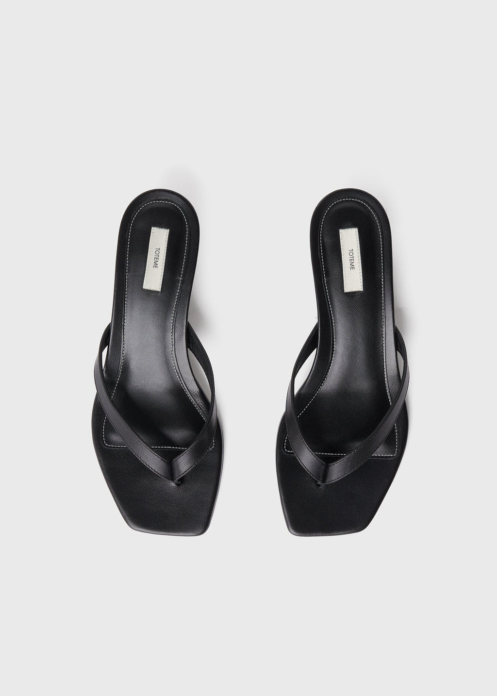 Leather heeled flip flops black
