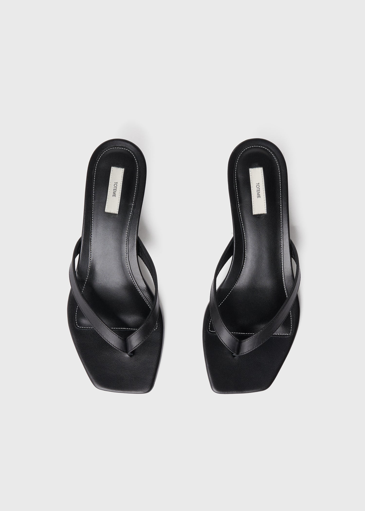 Leather heeled flip flops black